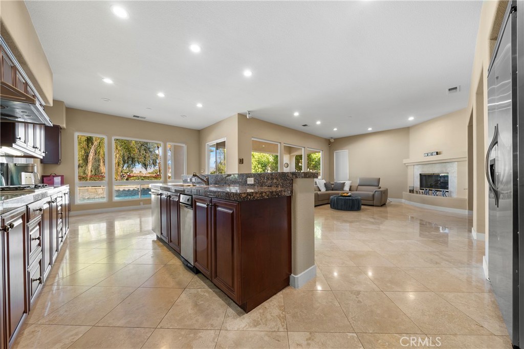 17 Oakmont Drive Rancho Mirage, CA 92270 - Photo 7 of 27 a kitchen with stainless steel appliances granite countertop a refrigerator and a sink