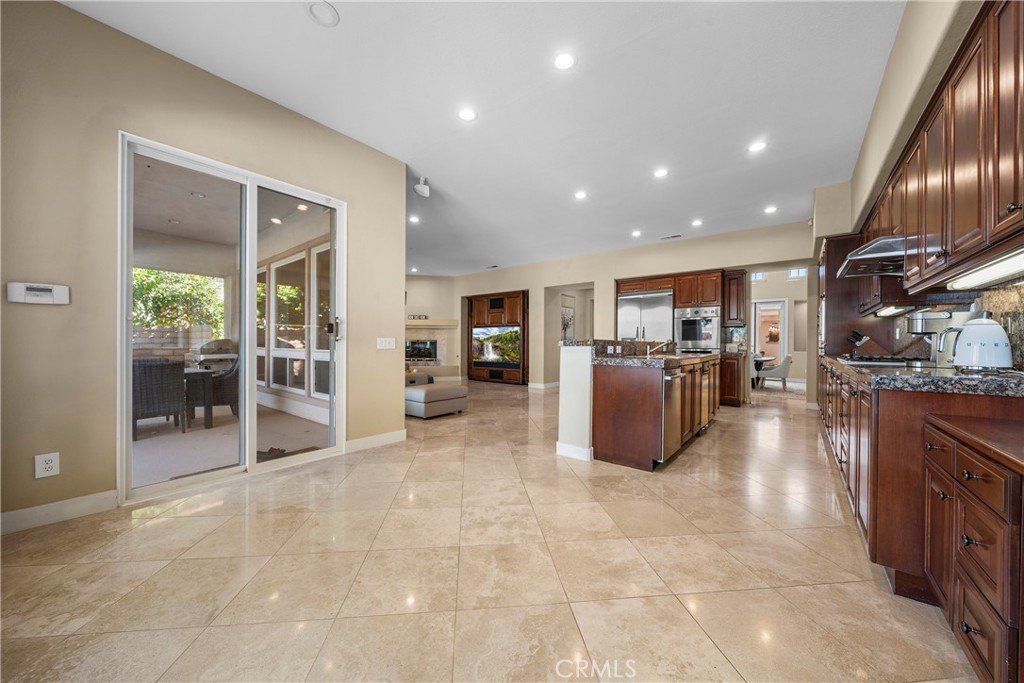 17 Oakmont Drive Rancho Mirage, CA 92270 - Photo 9 of 27 a open kitchen with stainless steel appliances granite countertop a refrigerator and stove top oven