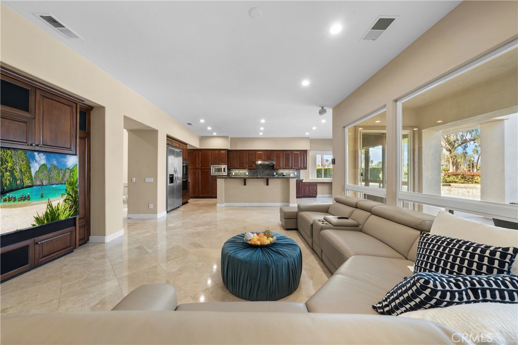 17 Oakmont Drive Rancho Mirage, CA 92270 - Photo 10 of 27 a living room with furniture and a large window