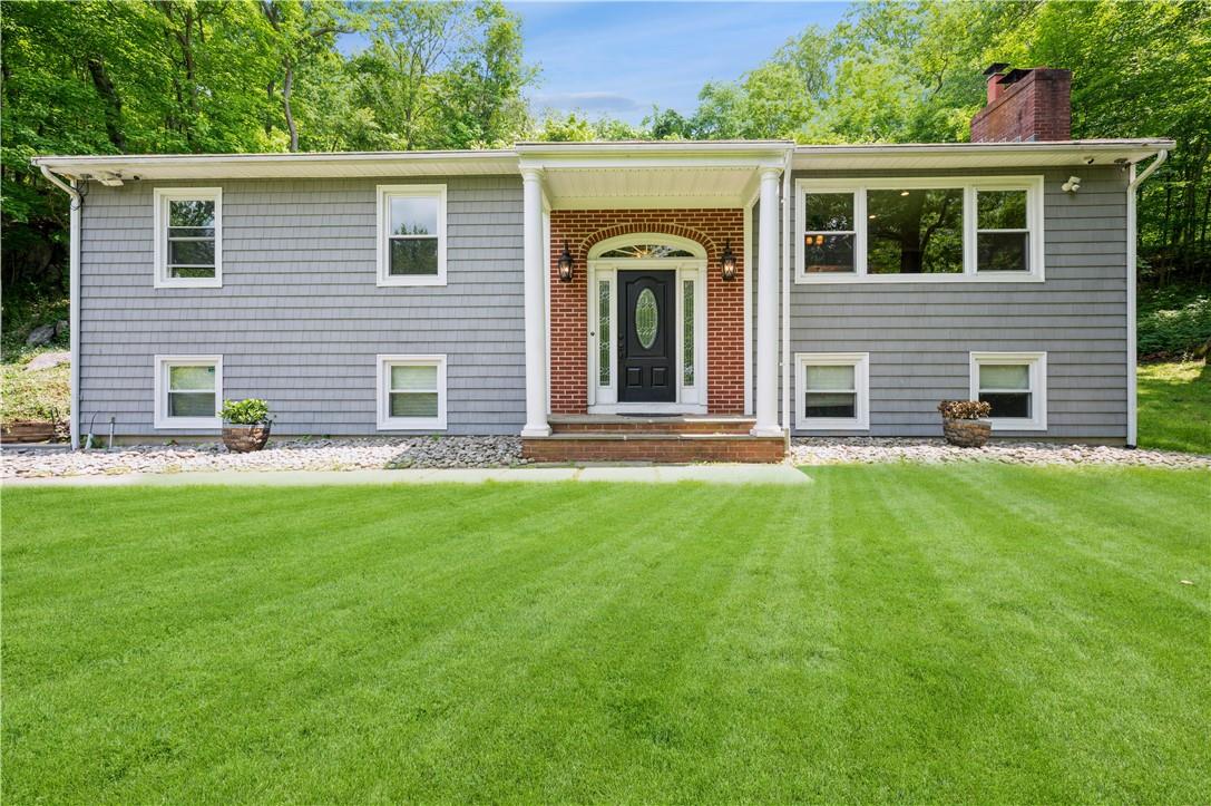 79 Mustato Road Katonah, NY 10536 - Photo 1 of 1 front view of a house with a yard