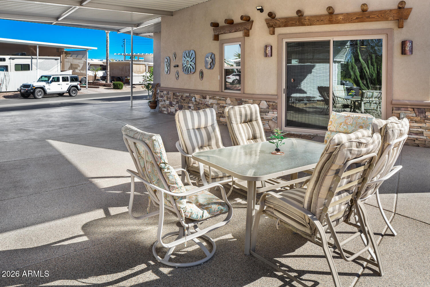 17200 West Bell Road, Unit 1054 Surprise, AZ 85374 - Photo 15 of 46 a view of a dining room with furniture a kitchen and chandelier