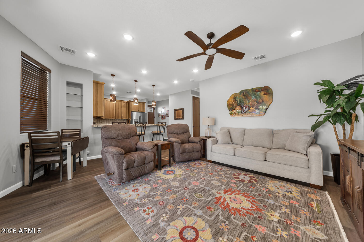 17200 West Bell Road, Unit 1054 Surprise, AZ 85374 - Photo 18 of 46 a living room with furniture and a flat screen tv with a potted plant