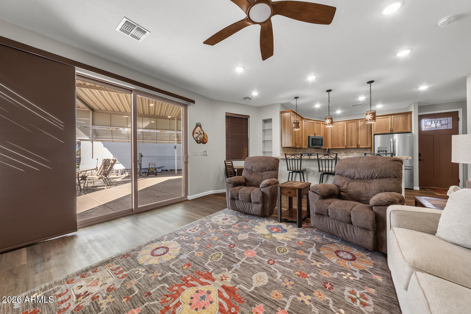 17200 West Bell Road, Unit 1054 Surprise, AZ 85374 - Photo 19 of 46 a living room with furniture and a floor to ceiling window