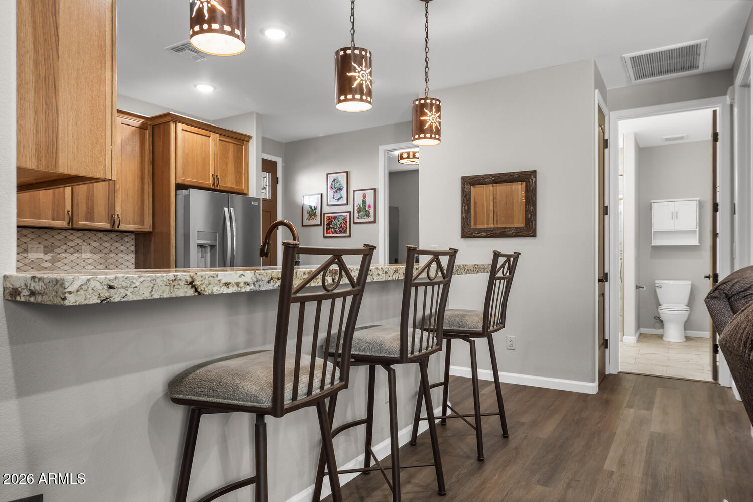 17200 West Bell Road, Unit 1054 Surprise, AZ 85374 - Photo 23 of 46 a view of a dining room with furniture and wooden floor