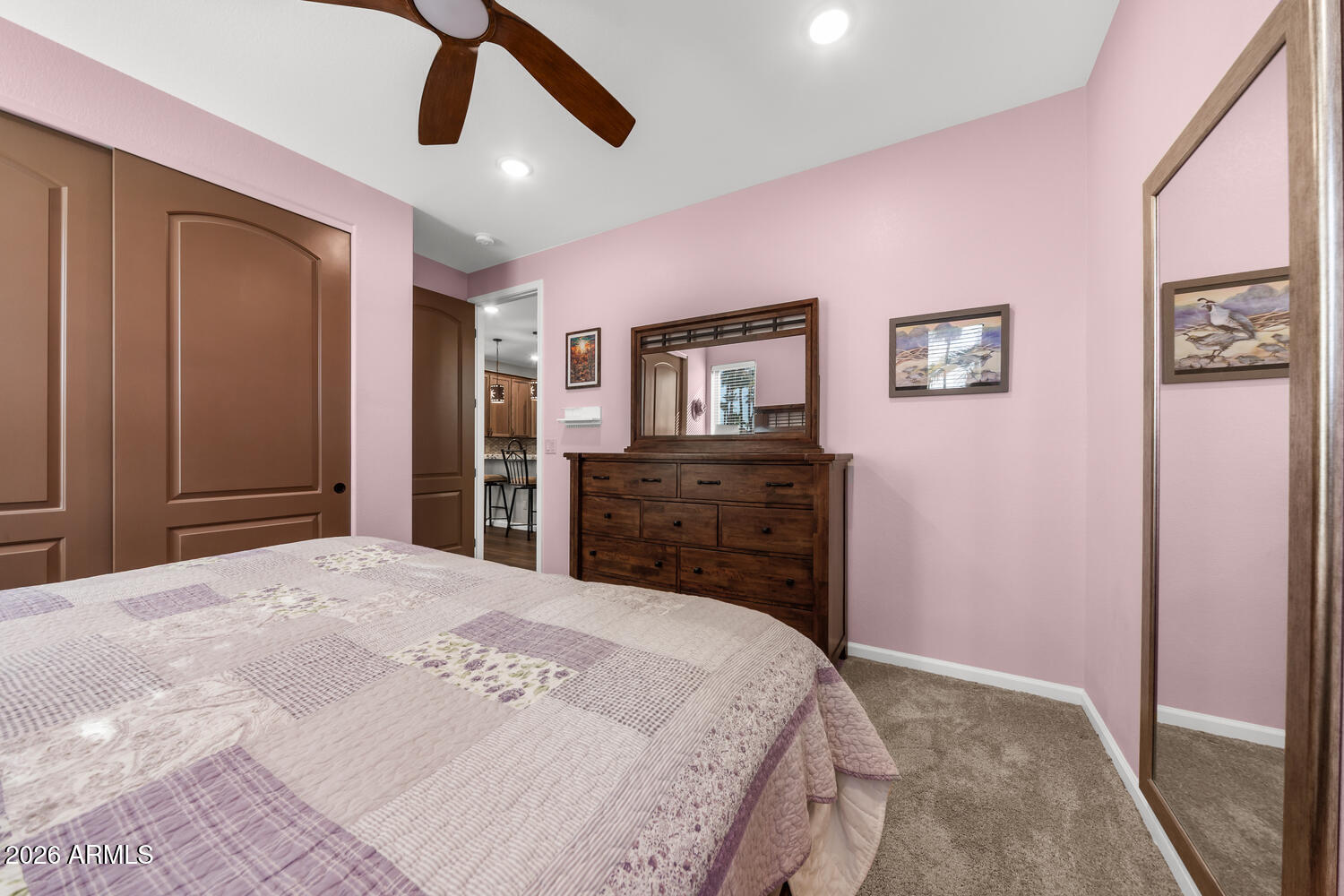 17200 West Bell Road, Unit 1054 Surprise, AZ 85374 - Photo 26 of 46 a bedroom with a bed and a dresser