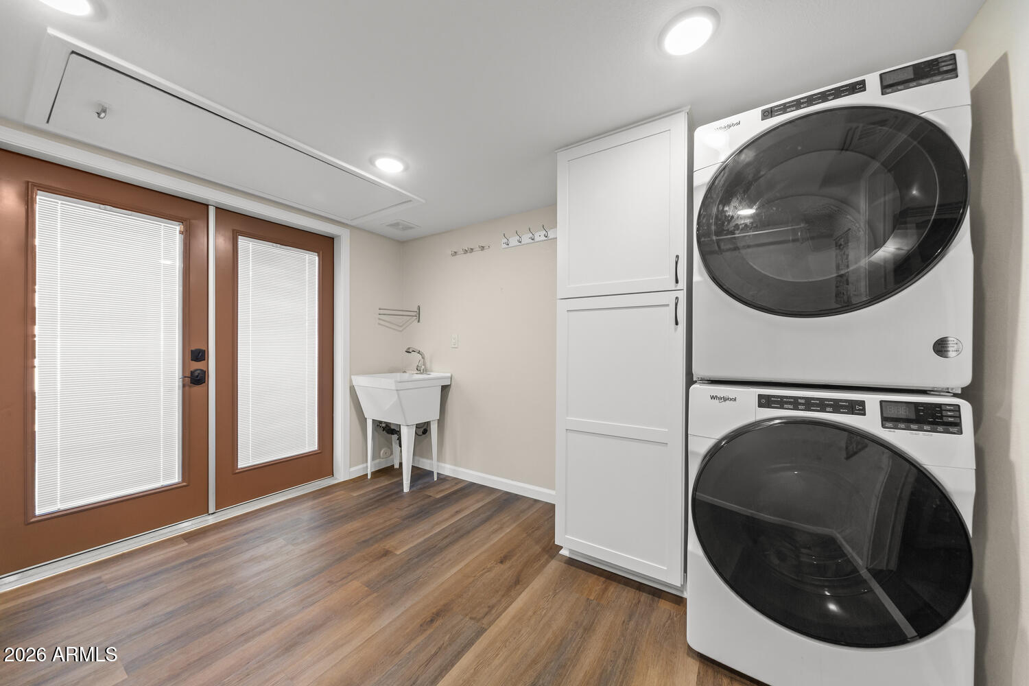 17200 West Bell Road, Unit 1054 Surprise, AZ 85374 - Photo 28 of 46 a view of a hallway with washer and dryer