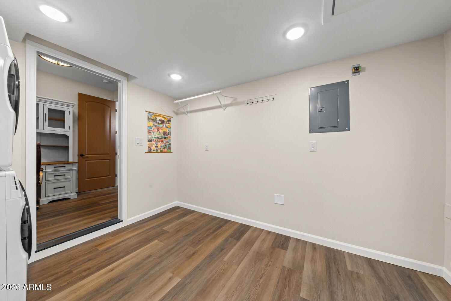 17200 West Bell Road, Unit 1054 Surprise, AZ 85374 - Photo 29 of 46 an empty room with wooden floor closet and windows