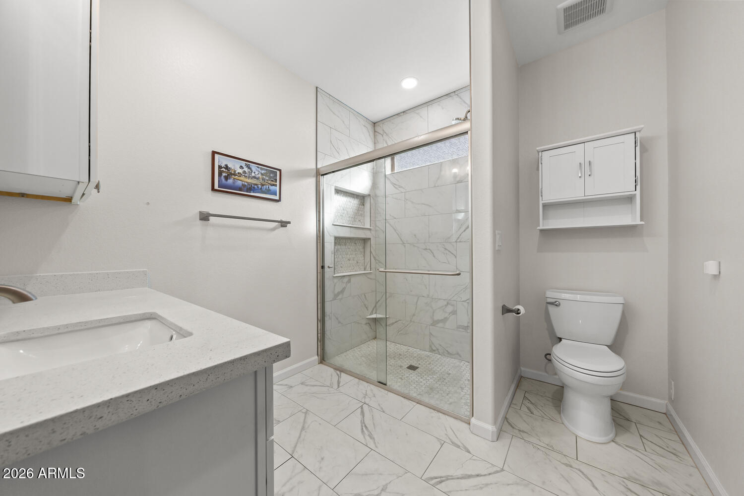 17200 West Bell Road, Unit 1054 Surprise, AZ 85374 - Photo 6 of 46 a bathroom with a shower toilet and sink