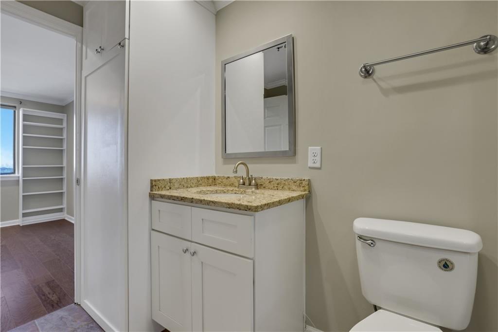 300 Johnson Ferry Road, Unit B902 Atlanta, GA 30328 - Photo 22 of 37 a bathroom with a granite countertop sink and a toilet