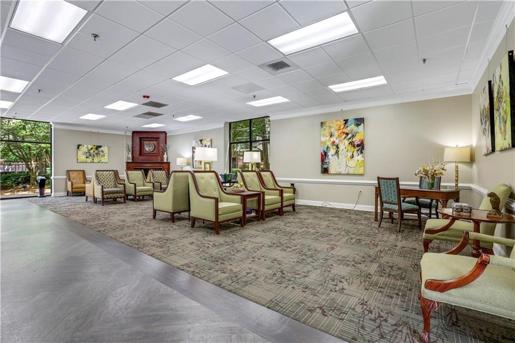 300 Johnson Ferry Road, Unit B902 Atlanta, GA 30328 - Photo 30 of 37 a living room with furniture and a table