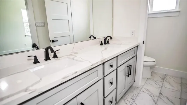 a bathroom with a sink and mirror