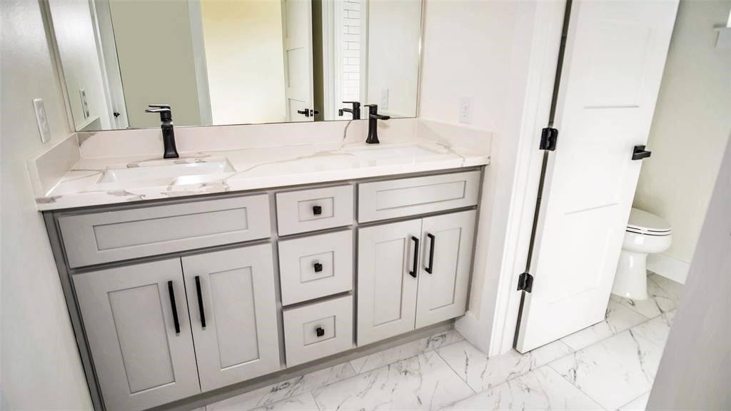 1508 Weiss Street Houston, TX 77009 - Photo 16 of 16 a bathroom with a sink and a mirror