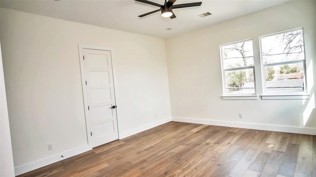 1508 Weiss Street Houston, TX 77009 - Photo 8 of 16 wooden floor in an empty room with a window