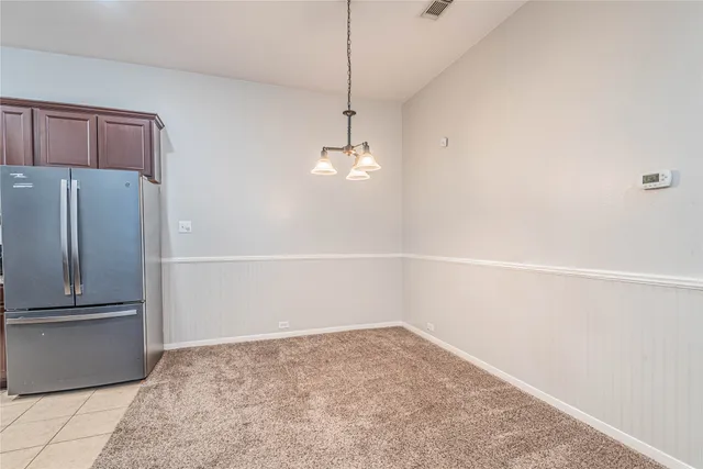 a large kitchen with stainless steel appliances granite countertop a stove and a sink