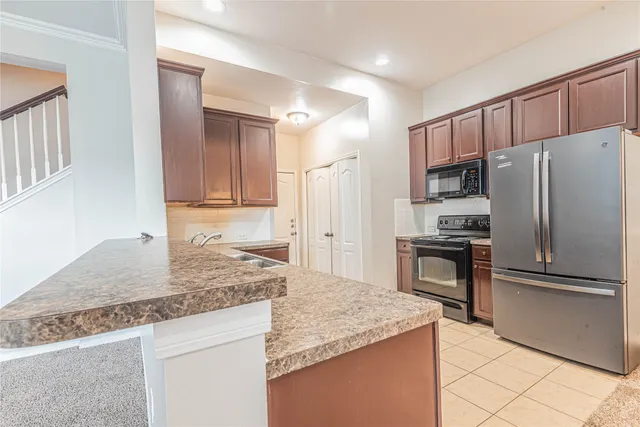 a view of empty room with stairs