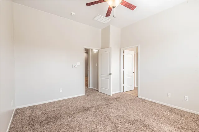 a bathroom with a tub a sink and a mirror