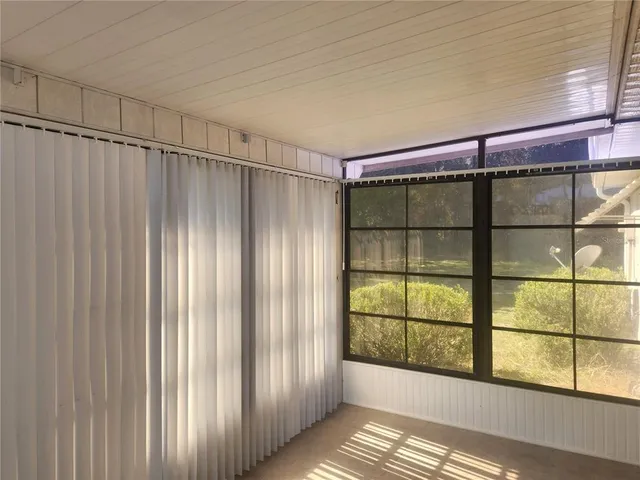 a view of a room with sliding glass door