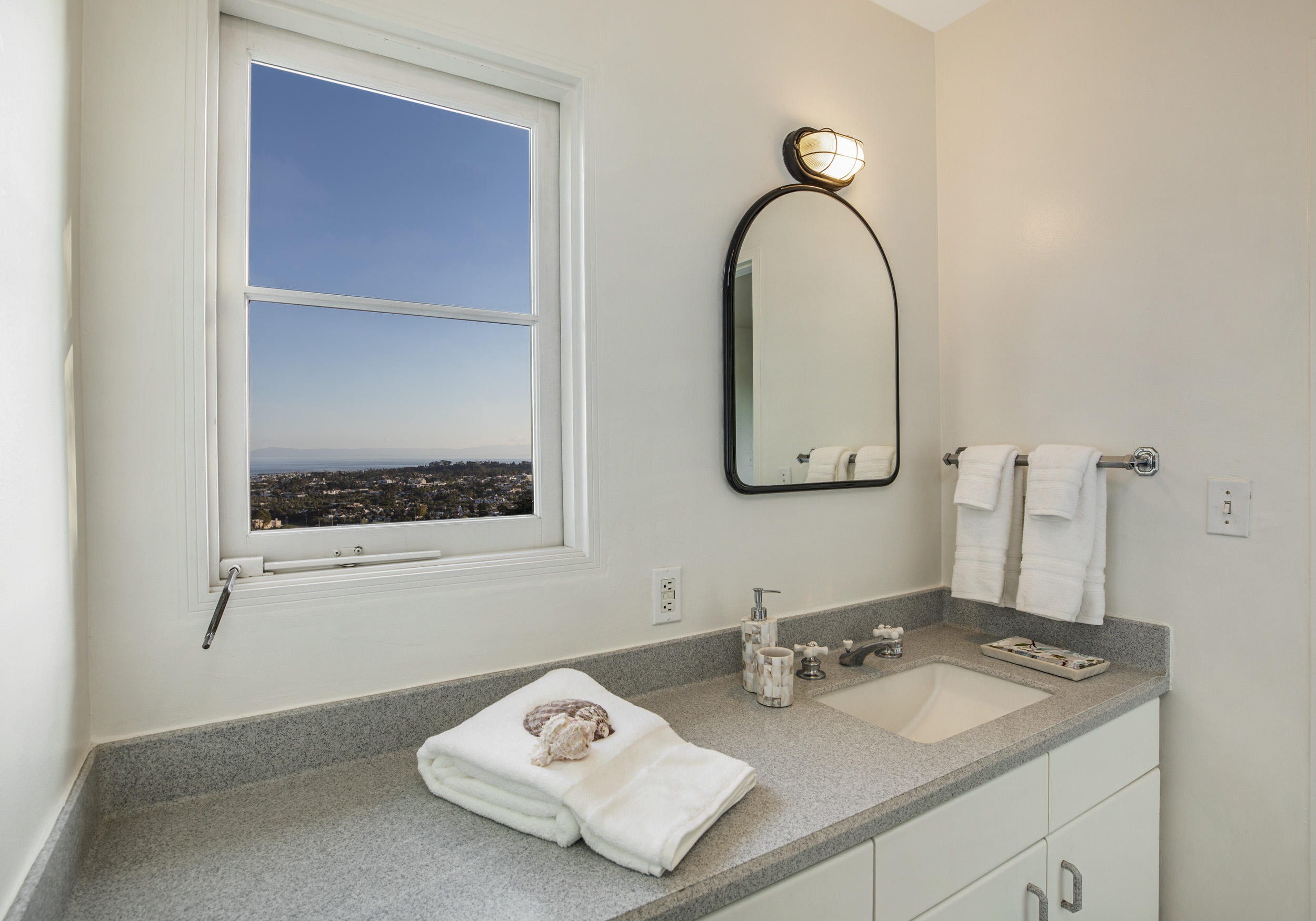 925 Jimeno Road Santa Barbara, CA 93103 - Photo 14 of 26 a bathroom with a sink and a mirror