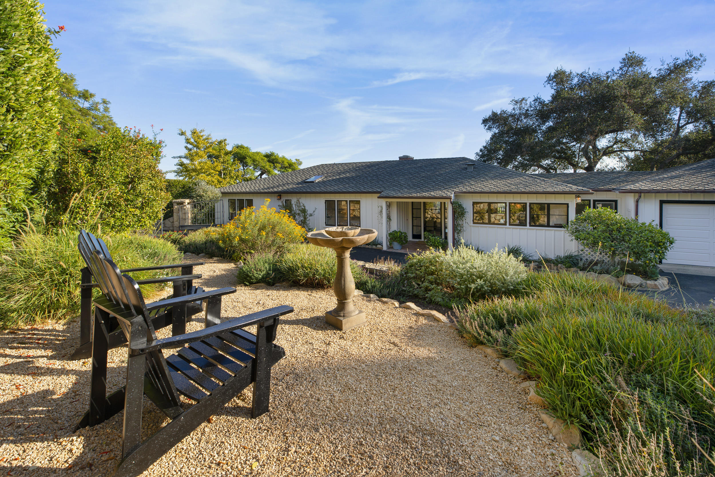 925 Jimeno Road Santa Barbara, CA 93103 - Photo 22 of 26 a view of a house with backyard and sitting area