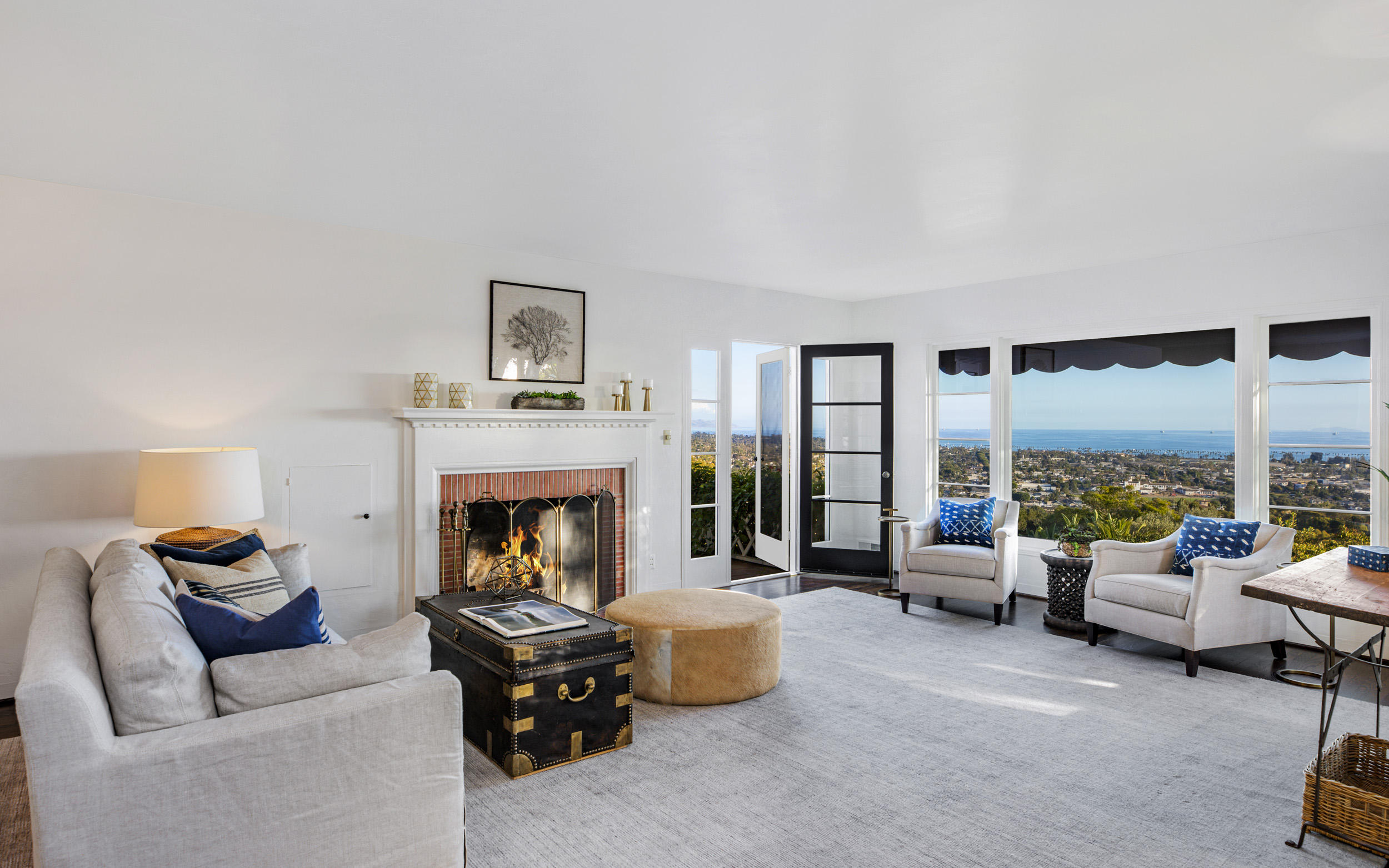925 Jimeno Road Santa Barbara, CA 93103 - Photo 5 of 26 a living room with furniture and a fireplace