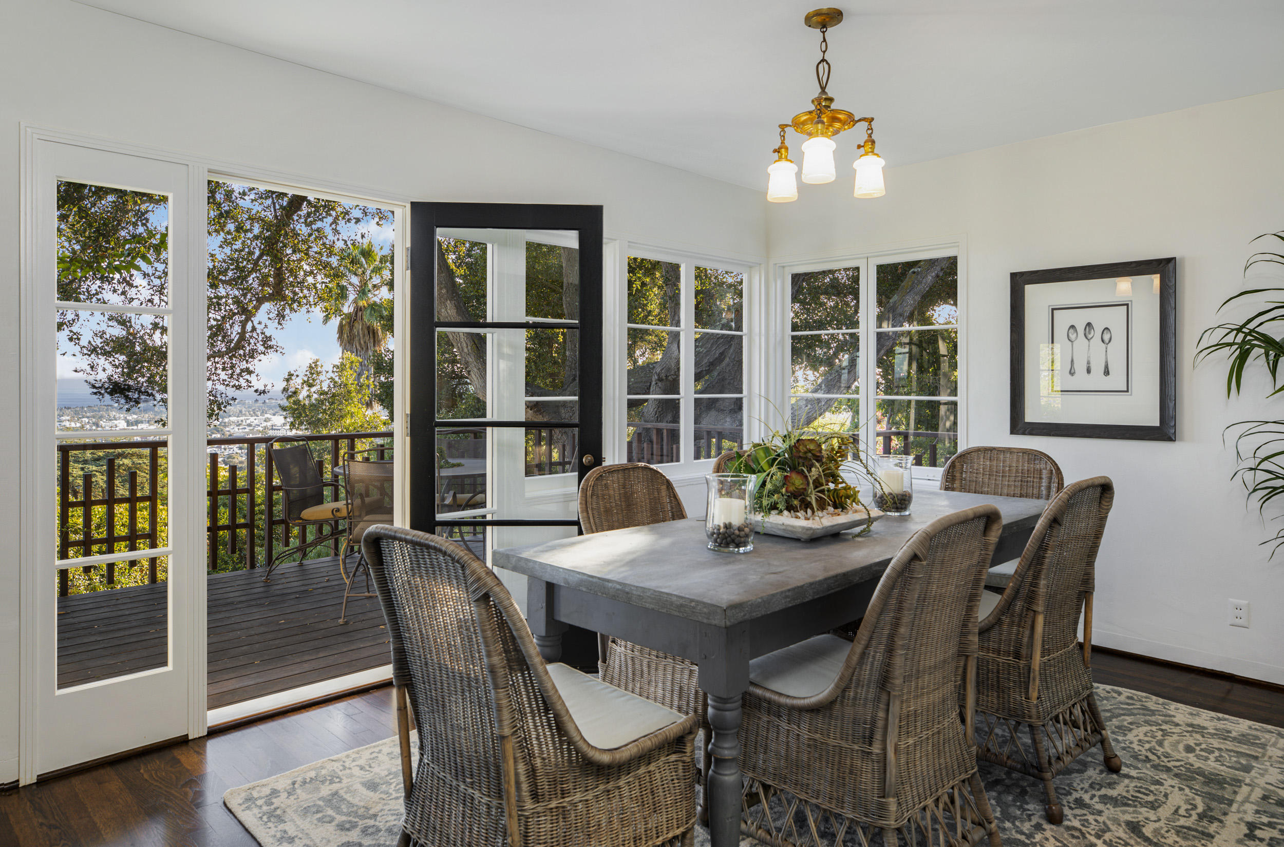 925 Jimeno Road Santa Barbara, CA 93103 - Photo 6 of 26 a dining room with furniture a window and wooden floor