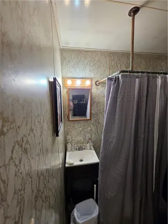 a bathroom with a sink and mirror
