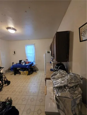 a bed room with a bed and a chair