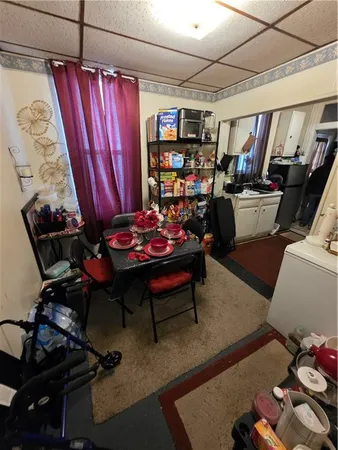 a room with furniture and musical instruments