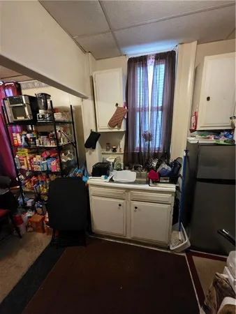 a room with lots of appliances and cabinets