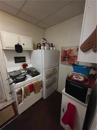 a kitchen with a stove and a refrigerator