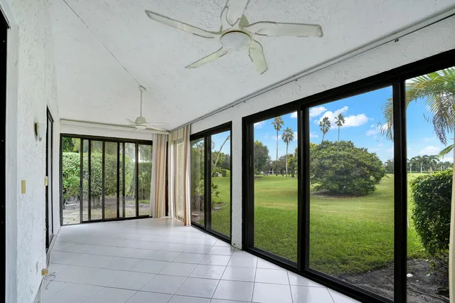 a view of a room with yard from balcony