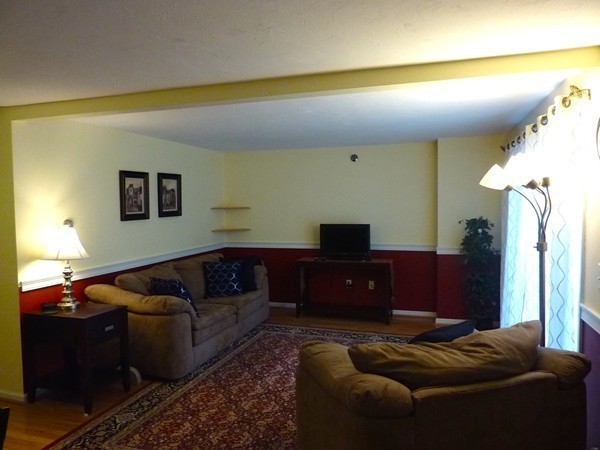 360 Littleton Road, Unit 18E Chelmsford, MA 01824 - Photo 4 of 13 a living room with furniture