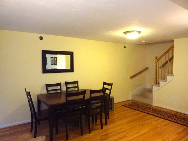 360 Littleton Road, Unit 18E Chelmsford, MA 01824 - Photo 5 of 13 a view of a dining room with furniture and wooden floor