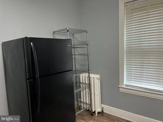 a view of a refrigerator in a kitchen