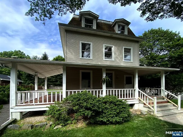 a house view with a garden space