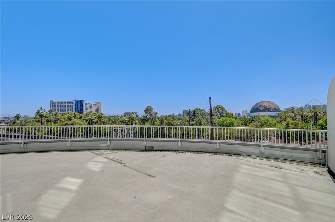 360 East Desert Inn Road, Unit 402 Las Vegas, NV 89109 - Photo 38 of 40 Unobstructed views from this elevated terrace provide a prime vantage point of the vibrant city.