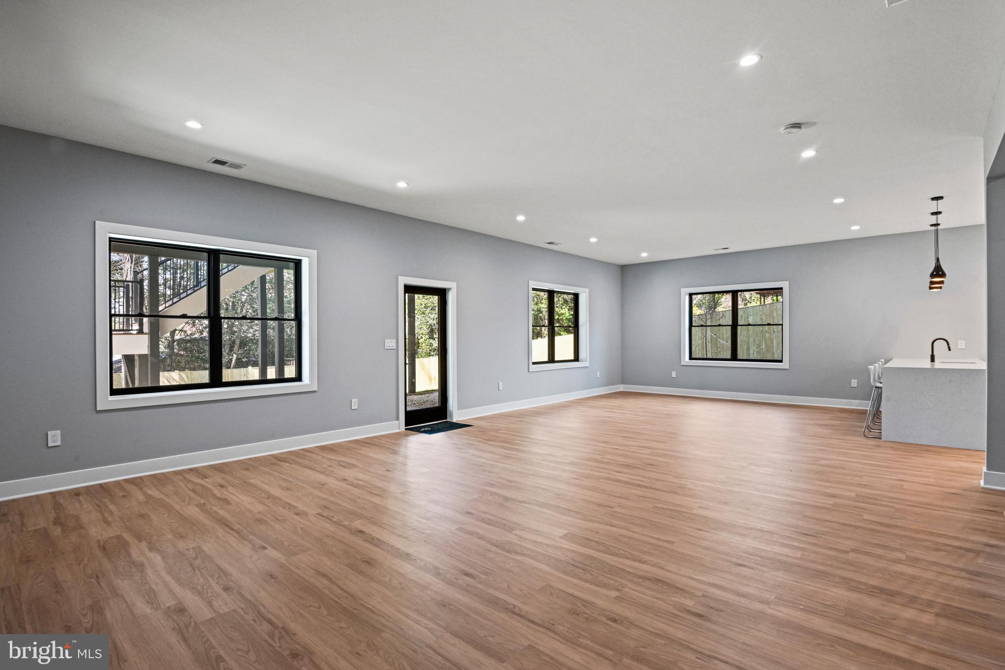 1052 Balls Hill Road McLean, VA 22101 - Photo 44 of 64 a view of an empty room with window and wooden floor