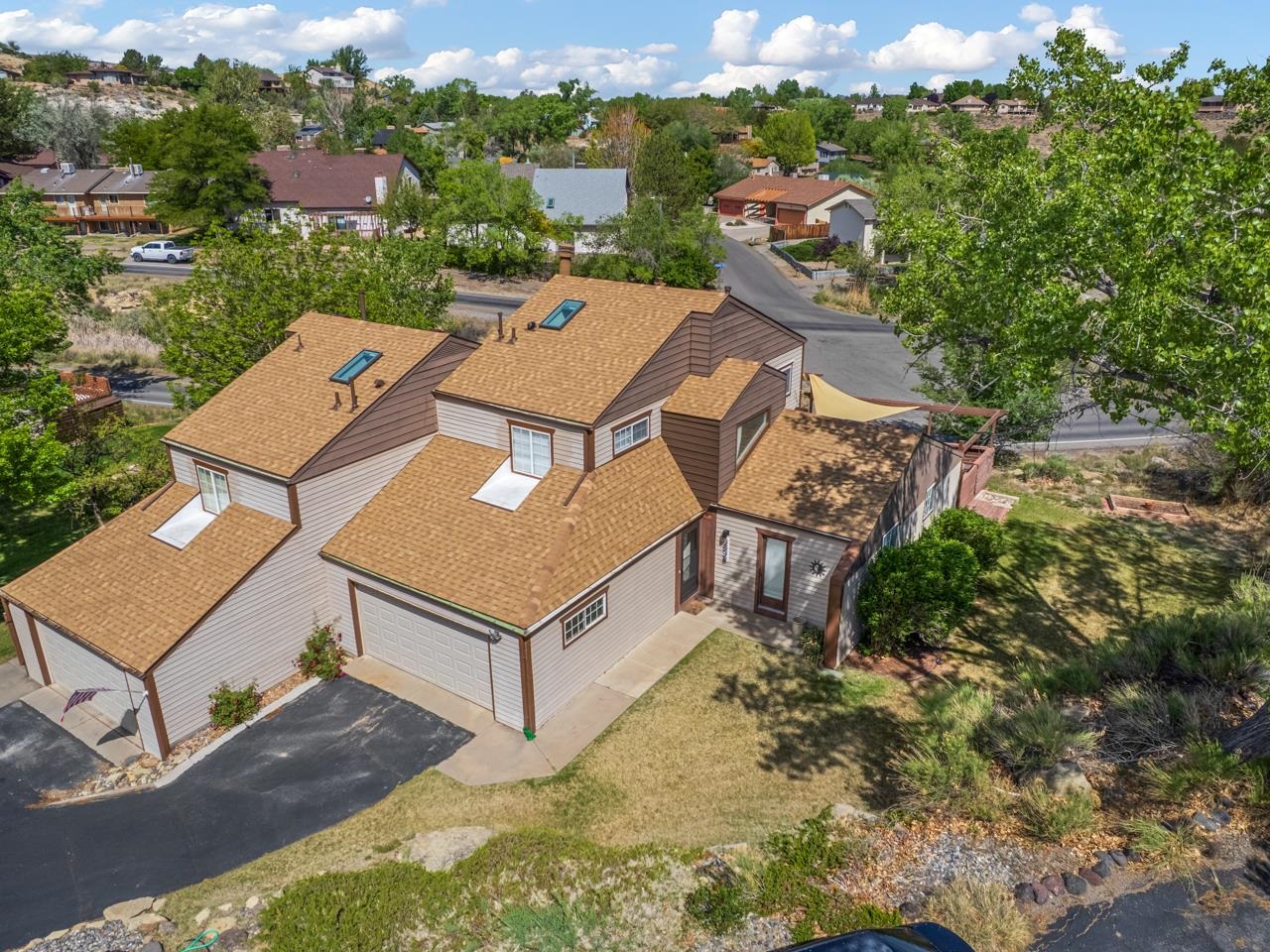 383 Explorer Court, Unit B Grand Junction, CO 81507 - Photo 1 of 40 an aerial view of a house with a yard