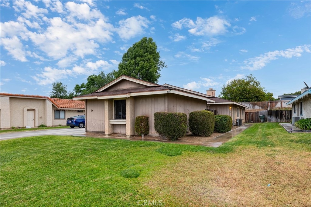3515 Albany Street Riverside, CA 92503 - Photo 1 of 1 a front view of a house with a yard and garage