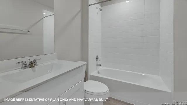 a bathroom with a sink a toilet and a bathtub