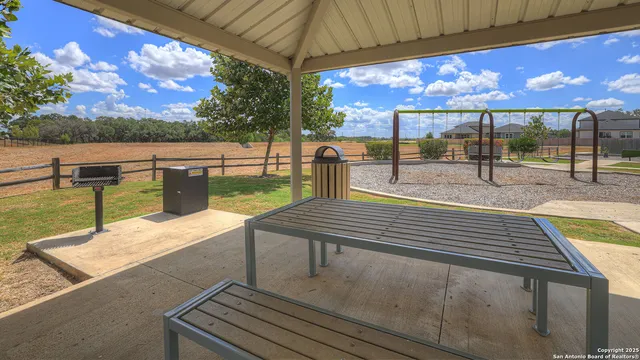 a swimming pool with outdoor seating
