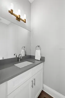 a bathroom with a sink and vanity