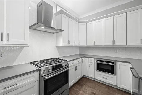 a kitchen with cabinets and appliances