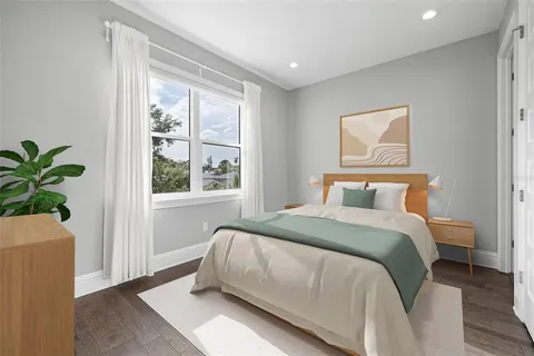 a bedroom with a bed and a couch