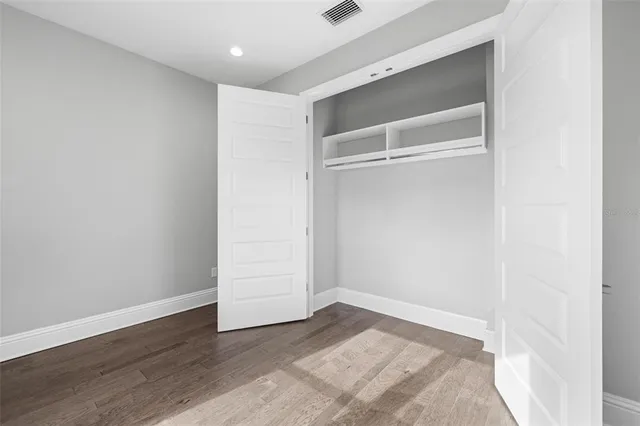 a view of staircase with white walls