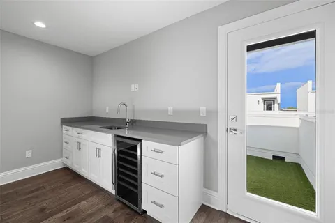 a view of a swimming pool with an outdoor seating and a yard