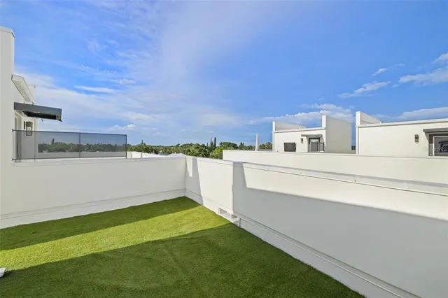 a living room with furniture and flowers