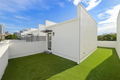 a view of a large building with large trees