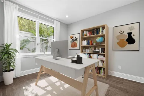 a workspace with furniture and window