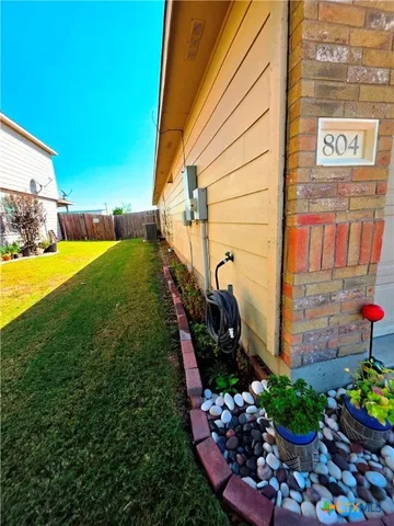 a view of a back yard of the house